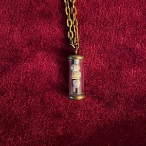 Vintage pendant, tube with maps (?) inside